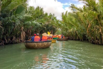 Experience Bamboo Basket Boat on Coconut village w Locals - Conical hats first: why locals hand you the shade