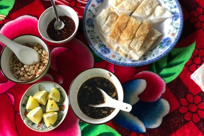 Half-day Hoi An Countryside Bike Tour and Basket Boat with Lunch - Stop 4: Noodle-making lunch with a family (and Banh Dap cake)