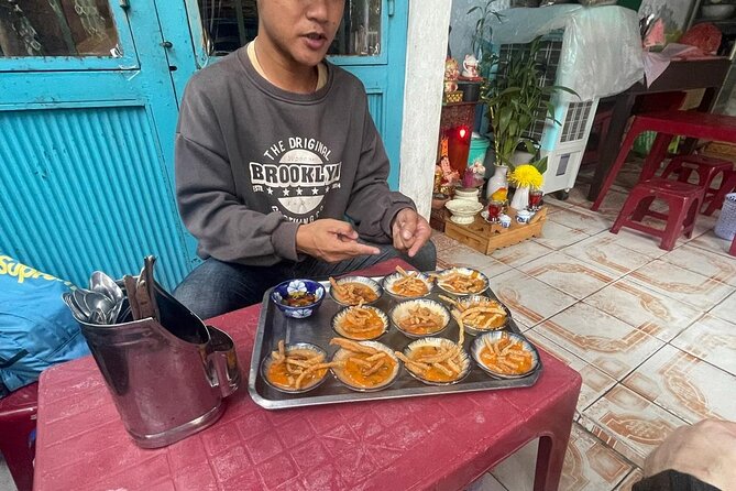 Half-day Private Street Food Tour in Hoi An - Bánh Xèo Nem Lụi at 49 Trần Hưng Đạo: hand-rolled and leaf-scented